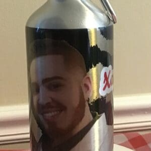 A water bottle with a picture of a man on it.