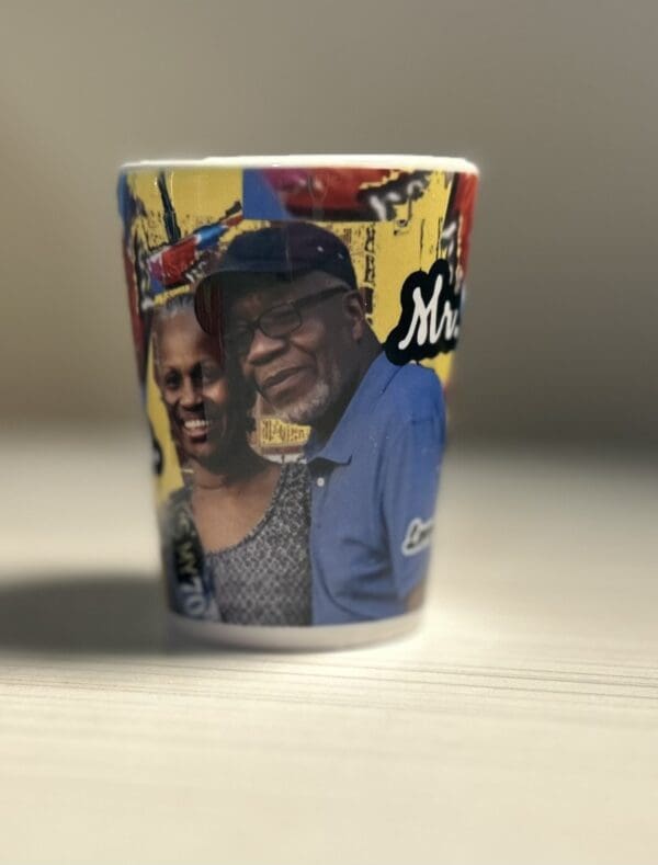 A close up of a cup with a picture on it