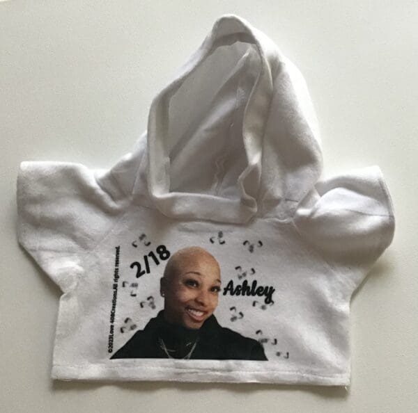 Customized Teddy Bear Hoodie with a printed portrait and name "ashley.